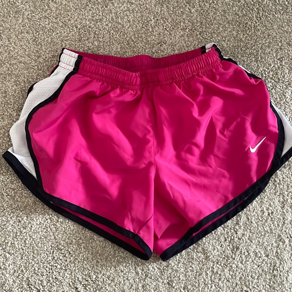 Girls Nike running shorts. Pink with black trim.